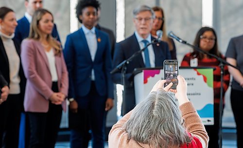 MIKE DEAL / FREE PRESS
Sport Minister Terry Duguid, minister responsible for Prairies Economic Development Canada, speaks during the event while a person takes a photo with a phone.
Federal Families, Children and Social Development Minister Jenna Sudds and Education and Early Childhood Learning Minister Tracy Schmidt announce that the federal and provincial governments have partnered with health-care facilities, schools and post-secondary institutions across the province to open up child-care spaces for children up to six years old, during a press conference held at the I.H. Asper Clinical Research Institute, St. Boniface Hospital, 369Tach&#xe9; Ave, Tuesday afternoon.
The event was attended by Nicole Aminot President and CEO St. Boniface Hospital, and other MLA&#x2019;s and MP&#x2019;s, Sport Minister Terry Duguid, minister responsible for Prairies Economic Development Canada, Health, Seniors and Long-term care Minister Uzoma Asagwara, Dan Vandal, member of Parliament, Saint Boniface-Saint Vital, Ben Carr, member of Parliament, Winnipeg South Centre, and Robert Loiselle, MLA for St. Boniface.
Reporter: Malak Abas 
250218 - Tuesday, February 18, 2025.