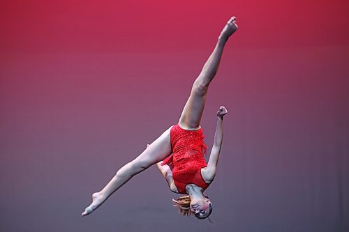19022025
Adeline Galinski flips through the air while performing in the dance, self-choreography, solo, own choice, 14 years and under category during the dance portion of the Brandon Festival of the Arts at the Western Manitoba Centennial Auditorium on Wednesday. The dance portion of the festival continues until Friday. (Tim Smith/The Brandon Sun)