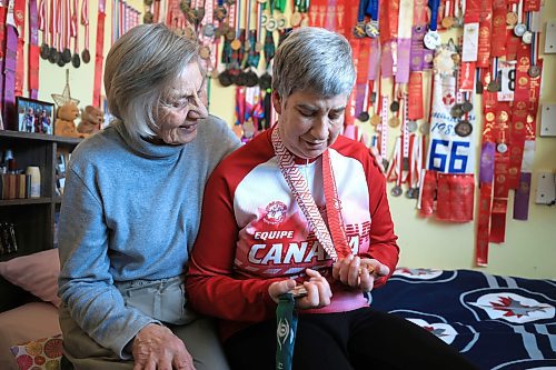 Ruth Bonneville / Free Press
LOCAL/SPORTS - Brita Hall
Photo of Brita Hall in her room with all her medals on the wall. Also with her mom, Birgit Hall.
Ahead of her trip to the World Winter Games in Turin, Italy next month, MB Sports Hall of Famer Brita Hall is deep in training mode. The four-time Paralympian, at age 55, continues to not only compete, but improve in cross-country skiing, building on a skillset she started developing as a teenager. Over the course of a long career in Nordic sports in Manitoba, Hall has been a trailblazer, becoming the first Special Olympic athlete to be enshrined in the MB Sports Hall of Fame last fall.
See story by Ben Waldman
February 19/25