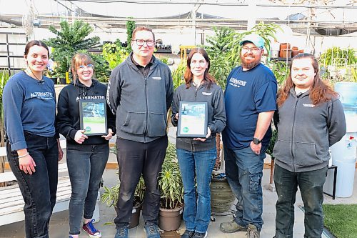 Alternative Group marketing manager Mike Mair (third from left), and his colleagues pose for a picture with the 2025 Manitoba Nursery Landscape Association (MBNLA) Awards of Excellence plaques. (Abiola Odutola/The Brandon Sun)