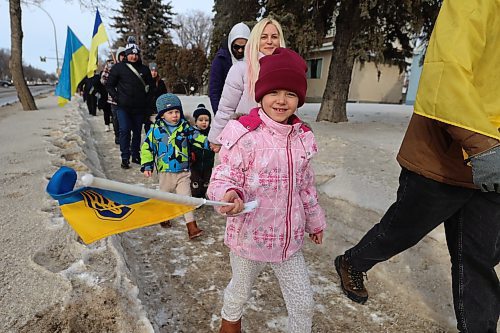 Children smile as they join the solidarity march from Brandon University to the city hall in solidarity with Ukraine reaching its three-years mark of war. (Abiola Odutola/The Brandon Sun)