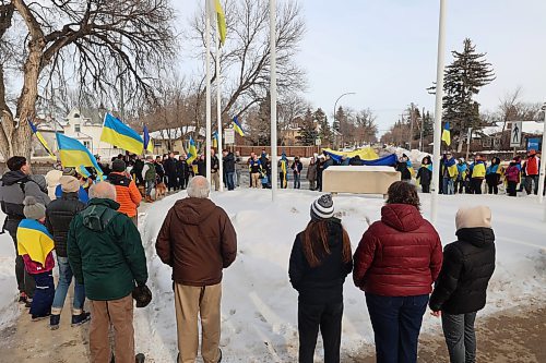 Ukrainians based in Brandon and residents gather for flag raising in front of Brandon University in solidarity with Ukraine reaching its three-years mark of war. (Abiola Odutola/The Brandon Sun)
