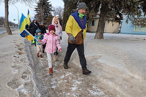 Children smile as they join the solidarity march from Brandon University to the city hall in solidarity with Ukraine reaching its three-years mark of war. (Abiola Odutola/The Brandon Sun)