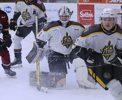 Mason Lobreau watches on through the spray of snow from an attacking forward. (Matt Packwood/The Brandon Sun)