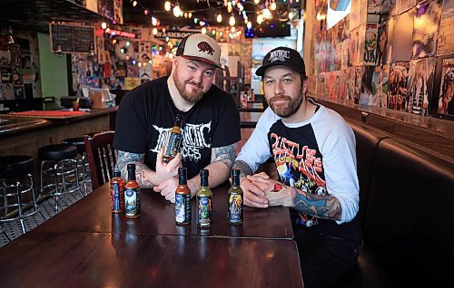 Ruth Bonneville / Free Press
Intergalactic Sauces co-owners Dan Trupp (left) and Josh Ayers show off their selection of small-batch hot sauces.