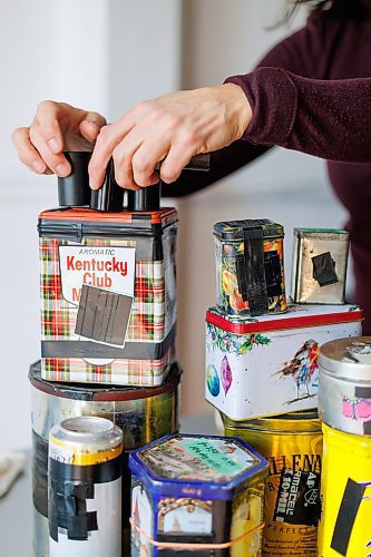 MIKE DEAL / FREE PRESS
Brenda Stuart is a photographer who specializes in solargraphy, a photographic method using a pinhole camera to capture the path of the sun. This is a form of pinhole photography using a long-exposure technique where the arc of the sun’s trails are recorded onto photographic paper as the sun’s position in the sky changes from solstice to solstice. Images can be made over a day, a week, a month, a year. Or even longer. A clear sunny day will record a strong bright arc across the photo paper. When the days are cloudy or partially cloudy the camera records dots and dashes.
Brenda shows off her many pin hole cameras in her studio.
Reporter: AV Kitching
250225 - Tuesday, February 25, 2025.