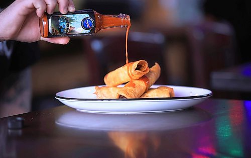 Ruth Bonneville / Free Press

ENT Intergalactic Sauces

Photo of Big Sky sauce with Taquitos.

Co-owners of  Intergalactic Sauces, Dan Trupp and Josh Ayers  (right, white sleeves) with their collection of sauces.

Story: for an Intersection piece on Intergalactic Sauces. Dan and his business partner Josh Ayers were doing pop-up taco stands in 2018 and 2019, and were producing their own hot sauces, to go along with their food. The pop-ups ground to a halt during COVID, which is when they switched gears, and concentrated on hot sauces, alone. 

They have five core flavours, but regularly collaborate with people/groups/organizations to come up with super-unique sauces; this week they're releasing a honey-dill sauce, in tandem with punk group Comeback Kid, to commemorate the anniversary of the band's debut album. 


See story by Dave

February  26th, 2025