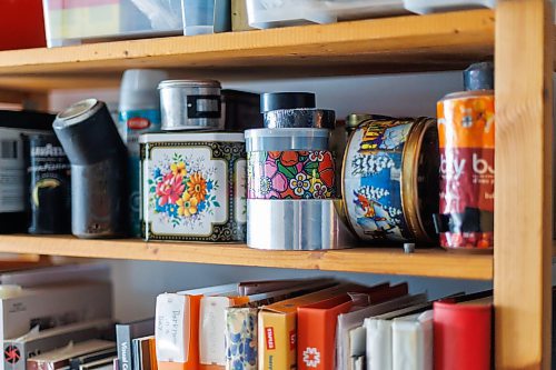 MIKE DEAL / FREE PRESS
Brenda Stuart is a photographer who specializes in solargraphy, a photographic method using a pinhole camera to capture the path of the sun. This is a form of pinhole photography using a long-exposure technique where the arc of the sun’s trails are recorded onto photographic paper as the sun’s position in the sky changes from solstice to solstice. Images can be made over a day, a week, a month, a year. Or even longer. A clear sunny day will record a strong bright arc across the photo paper. When the days are cloudy or partially cloudy the camera records dots and dashes.
Brenda has shelves of various shaped tins in her studio which can be used for pin hole photography.
Reporter: AV Kitching
250225 - Tuesday, February 25, 2025.