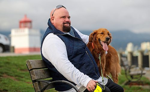 Chris Parlow and his dog, Delta, in Stanley Park, in Vancouver, B.C., Wednesday, November 27th, 2024. Chris is a recovering gambler who hasn't gambled since 2009. He speaks about his addiction which nearly led him to take his own life. (TREVOR HAGAN / WINNIPEG FREE PRESS)