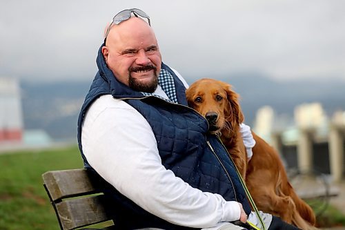 Chris Parlow and his dog, Delta, in Stanley Park, in Vancouver, B.C., Wednesday, November 27th, 2024. Chris is a recovering gambler who hasn't gambled since 2009. He speaks about his addiction which nearly led him to take his own life. (TREVOR HAGAN / WINNIPEG FREE PRESS)