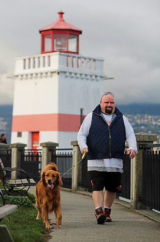 Chris Parlow and his dog, Delta, in Stanley Park, in Vancouver, B.C., Wednesday, November 27th, 2024. Chris is a recovering gambler who hasn't gambled since 2009. He speaks about his addiction which nearly led him to take his own life. (TREVOR HAGAN / WINNIPEG FREE PRESS)