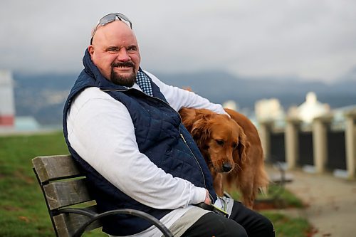 Chris Parlow and his dog, Delta, in Stanley Park, in Vancouver, B.C., Wednesday, November 27th, 2024. Chris is a recovering gambler who hasn't gambled since 2009. He speaks about his addiction which nearly led him to take his own life. (TREVOR HAGAN / WINNIPEG FREE PRESS)