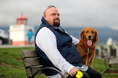 Chris Parlow and his dog, Delta, in Stanley Park, in Vancouver, B.C., Wednesday, November 27th, 2024. Chris is a recovering gambler who hasn't gambled since 2009. He speaks about his addiction which nearly led him to take his own life. (TREVOR HAGAN / WINNIPEG FREE PRESS)