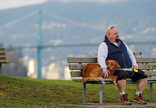 Chris Parlow and his dog, Delta, in Stanley Park, in Vancouver, B.C., Wednesday, November 27th, 2024. Chris is a recovering gambler who hasn't gambled since 2009. He speaks about his addiction which nearly led him to take his own life. (TREVOR HAGAN / WINNIPEG FREE PRESS)