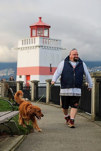 Chris Parlow and his dog, Delta, in Stanley Park, in Vancouver, B.C., Wednesday, November 27th, 2024. Chris is a recovering gambler who hasn't gambled since 2009. He speaks about his addiction which nearly led him to take his own life. (TREVOR HAGAN / WINNIPEG FREE PRESS)