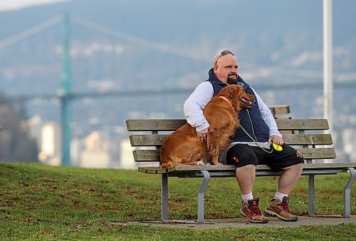 Chris Parlow and his dog, Delta, in Stanley Park, in Vancouver, B.C., Wednesday, November 27th, 2024. Chris is a recovering gambler who hasn't gambled since 2009. He speaks about his addiction which nearly led him to take his own life. (TREVOR HAGAN / WINNIPEG FREE PRESS)