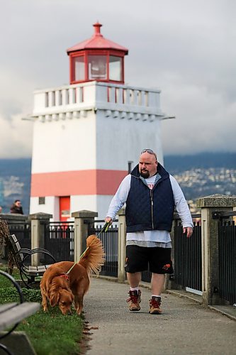 Chris Parlow and his dog, Delta, in Stanley Park, in Vancouver, B.C., Wednesday, November 27th, 2024. Chris is a recovering gambler who hasn't gambled since 2009. He speaks about his addiction which nearly led him to take his own life. (TREVOR HAGAN / WINNIPEG FREE PRESS)