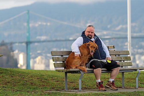Chris Parlow and his dog, Delta, in Stanley Park, in Vancouver, B.C., Wednesday, November 27th, 2024. Chris is a recovering gambler who hasn't gambled since 2009. He speaks about his addiction which nearly led him to take his own life. (TREVOR HAGAN / WINNIPEG FREE PRESS)
