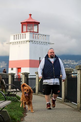 Chris Parlow and his dog, Delta, in Stanley Park, in Vancouver, B.C., Wednesday, November 27th, 2024. Chris is a recovering gambler who hasn't gambled since 2009. He speaks about his addiction which nearly led him to take his own life. (TREVOR HAGAN / WINNIPEG FREE PRESS)