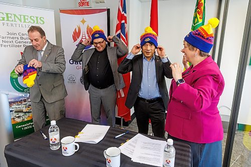 MIKE DEAL / FREE PRESS
(From left) Ron Kostyshyn, Minister of Agriculture, Jason Mann, President, Genesis Fertilizer, Chris Avery, CEO, Arctic Gateway Group and Lisa Naylor, Minister of Transportation and Infrastructure, put on Arctic Gateway toques after Jason Mann and Chris Avery signed a Letter of Intent for import and export shipments of phosphate and other fertilizer feedstocks through the Port of Churchill at the AGG office in the VIA Rail Station (Union Station), 123 Main Street, Friday morning.
Reporter: Gabrielle Piche
250307 - Friday, March 07, 2025.
