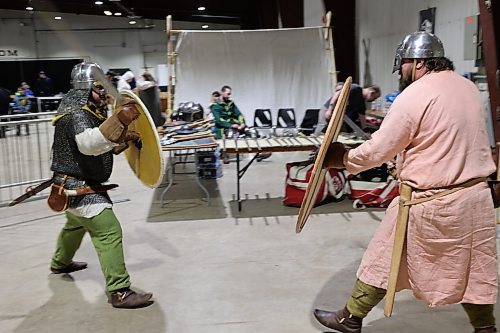 Left; Vikings re-enactors with Markland Vikings Mark Peters and Stefan Lindal do battle in their historical Vikings costume during the Westman Gaming Expo in the Manitoba Room Keystone Centre Sunday morning. (Abiola Odutola/The Brandon Sun)