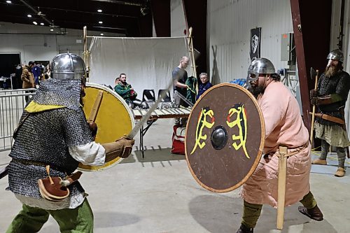 Left; Vikings re-enactors with Markland Vikings Mark Peters and Stefan Lindal do battle in their historical Vikings costume during the Westman Gaming Expo in the Manitoba Room Keystone Centre Sunday morning. (Abiola Odutola/The Brandon Sun)