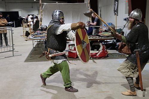 Left; Vikings re-enactors with Markland Vikings Mark Peters, and James Welbourne do battle in their historical Vikings costume during the Westman Gaming Expo in the Manitoba Room Keystone Centre Sunday morning. (Abiola Odutola/The Brandon Sun)