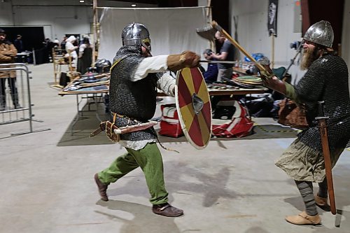 Left; Vikings re-enactors with Markland Vikings Mark Peters, and James Welbourne do battle in their historical Vikings costume during the Westman Gaming Expo in the Manitoba Room Keystone Centre Sunday morning. (Abiola Odutola/The Brandon Sun)