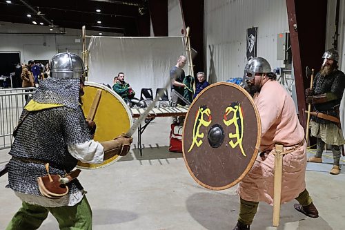 Left; Vikings re-enactors with Markland Vikings Mark Peters and Stefan Lindal do battle in their historical Vikings costume during the Westman Gaming Expo in the Manitoba Room Keystone Centre Sunday morning. (Abiola Odutola/The Brandon Sun)