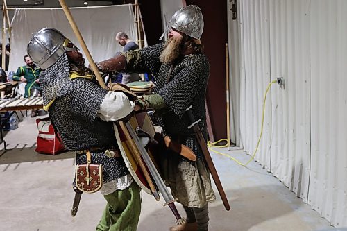 Left; Vikings re-enactors with Markland Vikings Mark Peters, and James Welbourne do battle in their historical Vikings costume during the Westman Gaming Expo in the Manitoba Room Keystone Centre Sunday morning. (Abiola Odutola/The Brandon Sun)