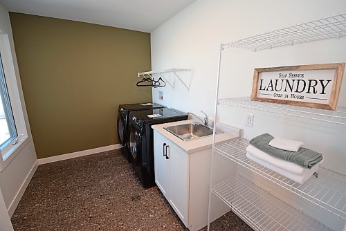 Todd Lewys / Free Press
There’s plenty of room to work in the bright, well-appointed second-floor laundry room.