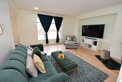 Todd Lewys / Free Press
Natural light pours into the spacious family room, while a simple cantilevered entertainment nook.