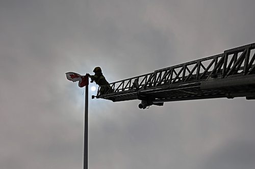 12032025
Devin Gellatly with Brandon Fire and Emergency Services replaces a Canadian flag atop The Dome Building in Brandon on Wednesday afternoon. BFES members took turns at the top of a ladder truck replacing multiple flags at The Dome Building.
(Tim Smith/The Brandon Sun)default