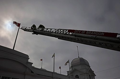 12032025
Brandon Fire and Emergency Services members scale the ladder on their ladder truck to replace a Canadian Flag at The Dome Building in Brandon on Wednesday afternoon. BFES members took turns at the top of a ladder truck replacing multiple flags at The Dome Building.
(Tim Smith/The Brandon Sun)