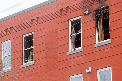 MIKE DEAL / FREE PRESS
A contractor measures one of the damaged window frames.
WFPS crews were still at the apartment building at 285 College Avenue where a fire was reported at 7:29 a.m. this morning. The city is reporting that there were no reported injuries and that the, “building sustained damage from smoke, fire, and water,” and that the cause of the fire is under investigation.

Reporter: Scott Billeck
250313 - Thursday, March 13, 2025.