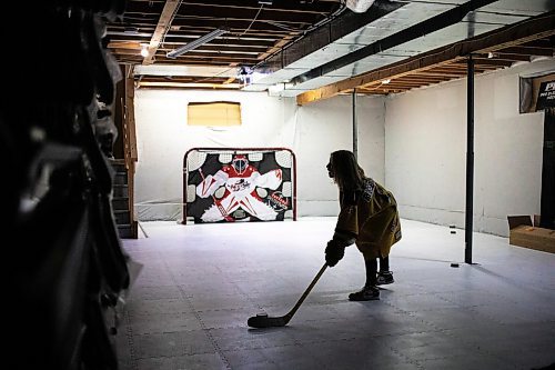 MIKAELA MACKENZIE / FREE PRESS
	

The boy who has been suspended from all hockey related activities in south Winnipeg by the South Winnipeg Hockey Association (due to his parents filing a defamation lawsuit against the association) shoots pucks in his basement training area on Friday, March 14, 2025. 

For Scott story.
Winnipeg Free Press 2025