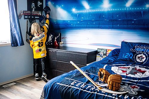 MIKAELA MACKENZIE / FREE PRESS
	

The boy who has been suspended from all hockey related activities in south Winnipeg by the South Winnipeg Hockey Association (due to his parents filing a defamation lawsuit against the association) in his hockey-themed room on Friday, March 14, 2025. 

For Scott story.
Winnipeg Free Press 2025