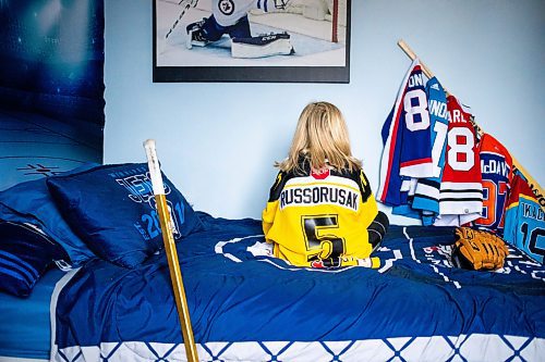 MIKAELA MACKENZIE / FREE PRESS
	

The boy who has been suspended from all hockey related activities in south Winnipeg by the South Winnipeg Hockey Association (due to his parents filing a defamation lawsuit against the association) in his hockey-themed room on Friday, March 14, 2025. 

For Scott story.
Winnipeg Free Press 2025