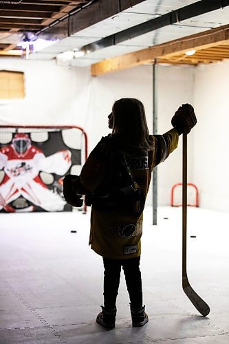 MIKAELA MACKENZIE / FREE PRESS
	

The boy who has been suspended from all hockey related activities in south Winnipeg by the South Winnipeg Hockey Association (due to his parents filing a defamation lawsuit against the association) in his basement training area on Friday, March 14, 2025. 

For Scott story.
Winnipeg Free Press 2025