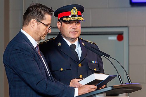MIKE DEAL / FREE PRESS
Winnipeg Police Service Chief of Police Gene Bowers is sworn-in during a ceremony held at the Pinnacle Club, Princess Auto Stadium, Monday morning. 
Chief Bowers took the official Oath of Allegiance and Office that was administered by Provincial Court Chief Judge Ryan Rolston. The oath marks the formal commencement of his duties as Chief, reaffirming his commitment to serving the people of Winnipeg with integrity and leadership.
250317 - Monday, March 17, 2025.
