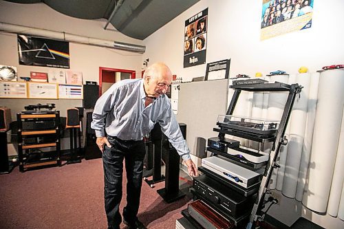 MIKAELA MACKENZIE / FREE PRESS
	

Dennis Penner, owner of American Hi-Fi, points out Canadian-made products in his audio store on Tuesday, March 18, 2025. 

For Malak story.
Winnipeg Free Press 2025
