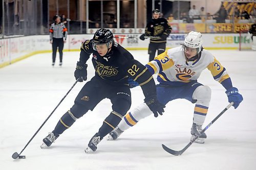 19032025
Dominik Petr #82 of the Brandon Wheat Kings tries to keep the puck away from Jordan Martin #3 of the Saskatoon Blades during WHL action at Westoba Place on Wednesday evening. 
(Tim Smith/The Brandon Sun)