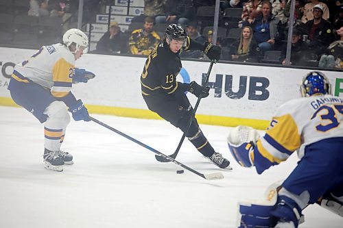 19032025
Roger McQueen #13 of the Brandon Wheat Kings skates in to take a shot on goalie Evan Gardner #35 of the Saskatoon Blades during WHL action at Westoba Place on Wednesday evening.
(Tim Smith/The Brandon Sun)