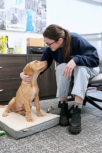 Gillian Leech in her office with pup Reggie, where her and sister Meredyth have taken over the family printing business. (Matt Packwood/The Brandon Sun)
