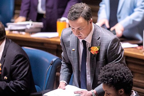MIKAELA MACKENZIE / FREE PRESS
Finance minister Adrien Sala lifts up the budget speech in the legislative chamber on budget day at the Manitoba Legislative Building on Thursday, March 20, 2025.
For budget stories.
Winnipeg Free Press 2025
