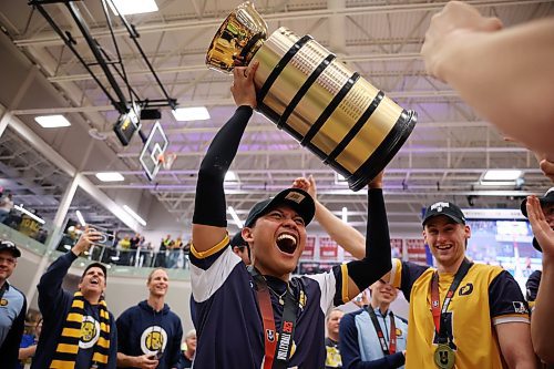 21032025
John Michael Flor of the Brandon Bobcats hoists the trophy as the Bobcats celebrate their 2025 U SPORTS Men's Volleyball Championship gold medal victory against University of Alberta Golden Bears at the Brandon University Healthy Living Centre on Sunday evening. The Bobcats defeated the Golden Bears in four sets. (Tim Smith/The Brandon Sun)