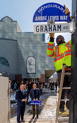 MIKE DEAL / FREE PRESS
Ian Allen with City of Winnipeg Traffic Services installs the sign while Mayor Scott Gillingham and Andre Lewis look on.
In 2025, André Lewis celebrates 50 years with Canada’s Royal Winnipeg Ballet. In recognition of his years of leadership, Mayor Scott Gillingham designats Graham Avenue between Edmonton Street and Carlton Street as André Lewis Way during a ceremony Monday afternoon outside the RWB at 380 Graham Ave.
Standup
250324 - Monday, March 24, 2025.