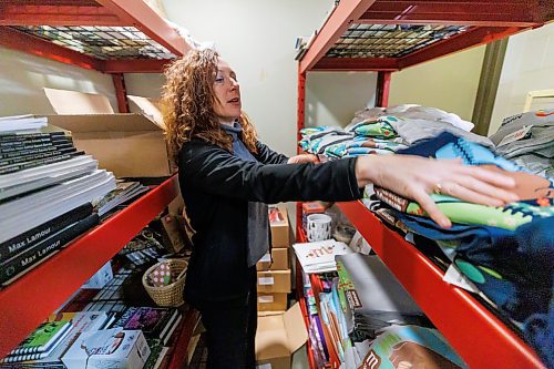 MIKE DEAL / FREE PRESS
The ShopM at the Manitoba Museum, 190 Rupert Ave, where customers can purchase museum merchandise, books, Manitoba made items and Canadian made items. The shop is currently under construction with a projected spring re-opening.
Rhiannon Leier Blocher, director of marketing, sales and visitor experience at the Manitoba Museum, looks through a storage room holding a number of items from the gift shop which is under construction.
Reporter: AV KItching
250226 - Wednesday, February 26, 2025.