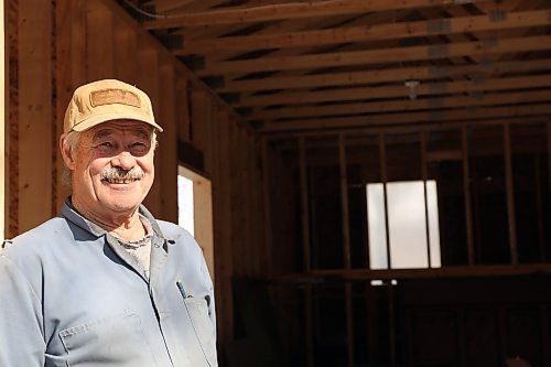 Neil Friesen stands in his newly built garage at the site of an abandoned home in Wawanesa. Friesen plans to remodel the home then put it up for sale, after buying the property for $11,000 at an auction. (Connor McDowell/Brandon Sun)