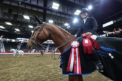 Hryshko and Vesuvio sport the pair's first-place ribbon on Monday night following their Gambler's Choice win. (Matt Goerzen/The Brandon Sun)